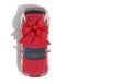 Red car wrapped in a red ribbon bow on a white background. Expensive gift. Top view. 3D render with copy space.