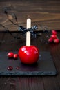 Red caramel apple. Close up. Traditional dessert recipe for Halloween party. Selective focus