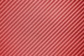 Red carbon fiber composite raw material. Royalty Free Stock Photo