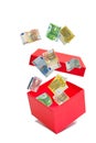 Red cardboard box with banknotes in a collage Royalty Free Stock Photo
