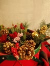 Red cardinal among Christmas evergreens, pine cones, red berries, frosted, Christmas drum basket,