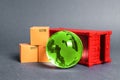 Red cargo container with boxes and green planet earth glass ball. Business and industry, transport infrastructure.