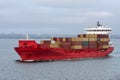 Red cargo container ship at sea. Royalty Free Stock Photo