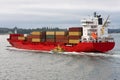 Red cargo container ship at sea. Royalty Free Stock Photo