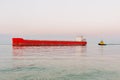 A red cargo ship is sailing on the sea Royalty Free Stock Photo