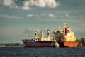 Red cargo ship and the tug ship Royalty Free Stock Photo