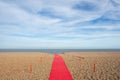 Red carpet on a beach Royalty Free Stock Photo