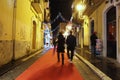Red carpet and Christmas lights decorations in the street of Foggia Royalty Free Stock Photo