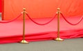 Red carpet entrance with golden stanchions and ropes. Celebrity nominees to premiere. Stars on the festive awarding of prizes Royalty Free Stock Photo