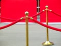 Red carpet entrance with golden stanchions and ropes. Celebrity nominees to premiere. Stars on the festive awarding of prizes Royalty Free Stock Photo