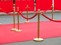 Red carpet entrance with golden stanchions and ropes. Celebrity nominees to premiere. Stars on the festive awarding of prizes Royalty Free Stock Photo