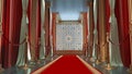 red carpet with golden barriers leading to arabisque background with gold columns on the side,