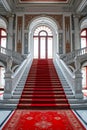 Red carpet is laid out before set of ornate marble stairs. Generative AI