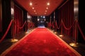 red carpet leading to red velvet theater curtain, with view of the audience visible beyond Royalty Free Stock Photo