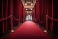 red carpet leading to red velvet theater curtain, with view of the audience visible beyond Royalty Free Stock Photo