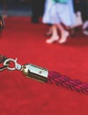 Red carpet with ropes and golden barriers on a luxury party entrance, cinema premiere film festival event award gala ceremony, Royalty Free Stock Photo