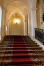 Red carpet on staircase in luxury interior Royalty Free Stock Photo