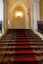 Red carpet on the staircase in luxury interior Royalty Free Stock Photo