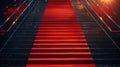 Red carpet on the stairs on a dark background. The path to glory, victory and success Royalty Free Stock Photo