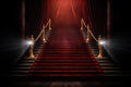 Red carpet on the stairs on a dark background. The path to glory, victory and success Royalty Free Stock Photo