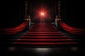 Red carpet on the stairs on a dark background. The path to glory, victory and success Royalty Free Stock Photo