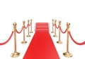 Red carpet and stairs between two gold stanchions with rope. Royalty Free Stock Photo