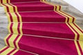 Red carpet. Stairwell in the Polish palace. Royal castle in Warsaw. Royalty Free Stock Photo