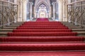 Red carpet on the steps of the building. Staircase in a palace Royalty Free Stock Photo