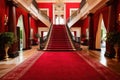 red carpet stretching through the grand foyer of an elegant mansion Royalty Free Stock Photo