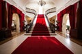 red carpet stretching through the grand foyer of an elegant mansion Royalty Free Stock Photo