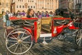 Red carriage in the historic center of Prague for the tour of the city