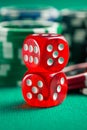 The red casino dice and casino chips Royalty Free Stock Photo