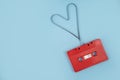 Red cassette tape on background