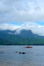 A Red Catamaran Off the Coastline of Kauaii