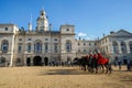 Red cavalryman troop on strong black horse at The Household Cavalry Museum in London