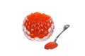 red caviar in a caviar bowl with a spoon standing next to it on a white isolated background Royalty Free Stock Photo