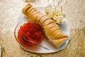 Red caviar, bread, butter in white plate. Close-up salmon caviar. Seafood