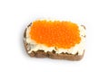 Red caviar and butter smeared on a piece of black bread Royalty Free Stock Photo