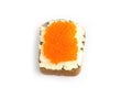 Red caviar and butter smeared on a piece of black bread Royalty Free Stock Photo