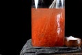 Red caviar in egg sack in a glass jar