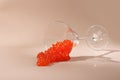 Red caviar. Caviar fell out of the glass. A useful omega. A natural product. Caviar of salmon or sturgeon fish.Light