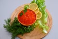 Red caviar and fresh greens