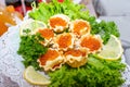 Red caviar and grated cheese in small dough baskets. A delicious cold appetizer with seafood. Close up