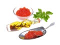 Red caviar ,green spices, silver spoon,isolated on white background .Selective