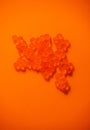 Red Caviar macro shot, Caviar over orange background. Fish roe, Close-up salmon or trout caviar. Delicatessen