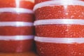 Red caviar plactic jars, rows of salted canned red caviar containers filled to the top on a seafood production, packaging and