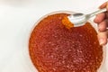 red caviar in plastic container. Salmon caviar, diet food Royalty Free Stock Photo