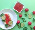 Red caviar of salmon fish, sandwich, cucumber, parsley. Royalty Free Stock Photo