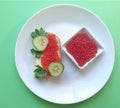 Red caviar of salmon fish, sandwich, cucumber, parsley. Royalty Free Stock Photo