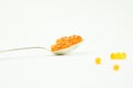 Red caviar in a silver spoon. Eat caviar